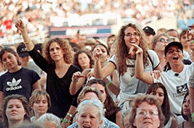 Lilith Fair concertgoers cheer ovaried singer Shawn Colvin.